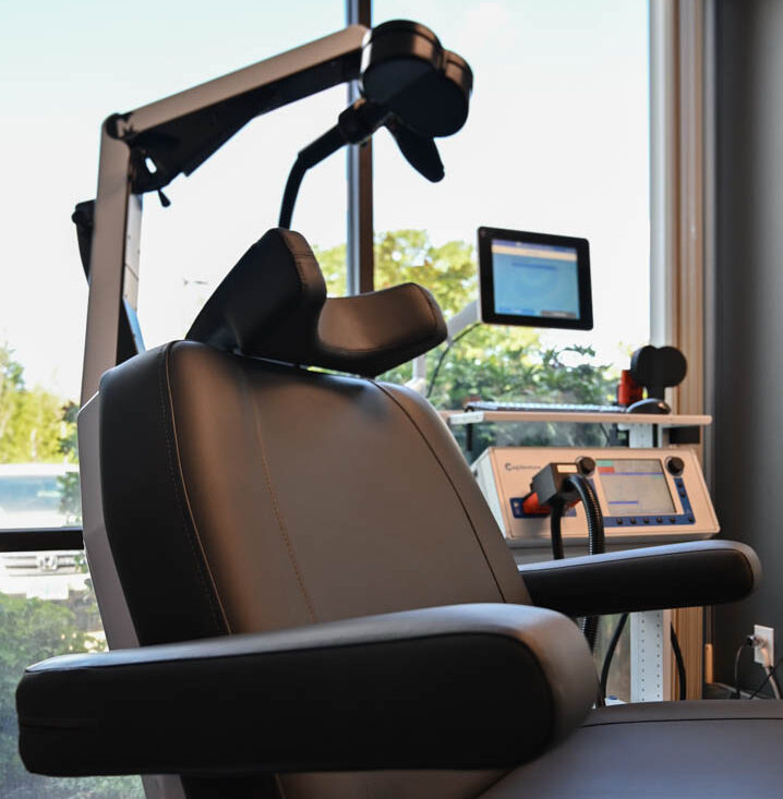 20250820 191022680 ios 3 e1756844810380 A vertical photo of a black tms chair in front of a bright window.